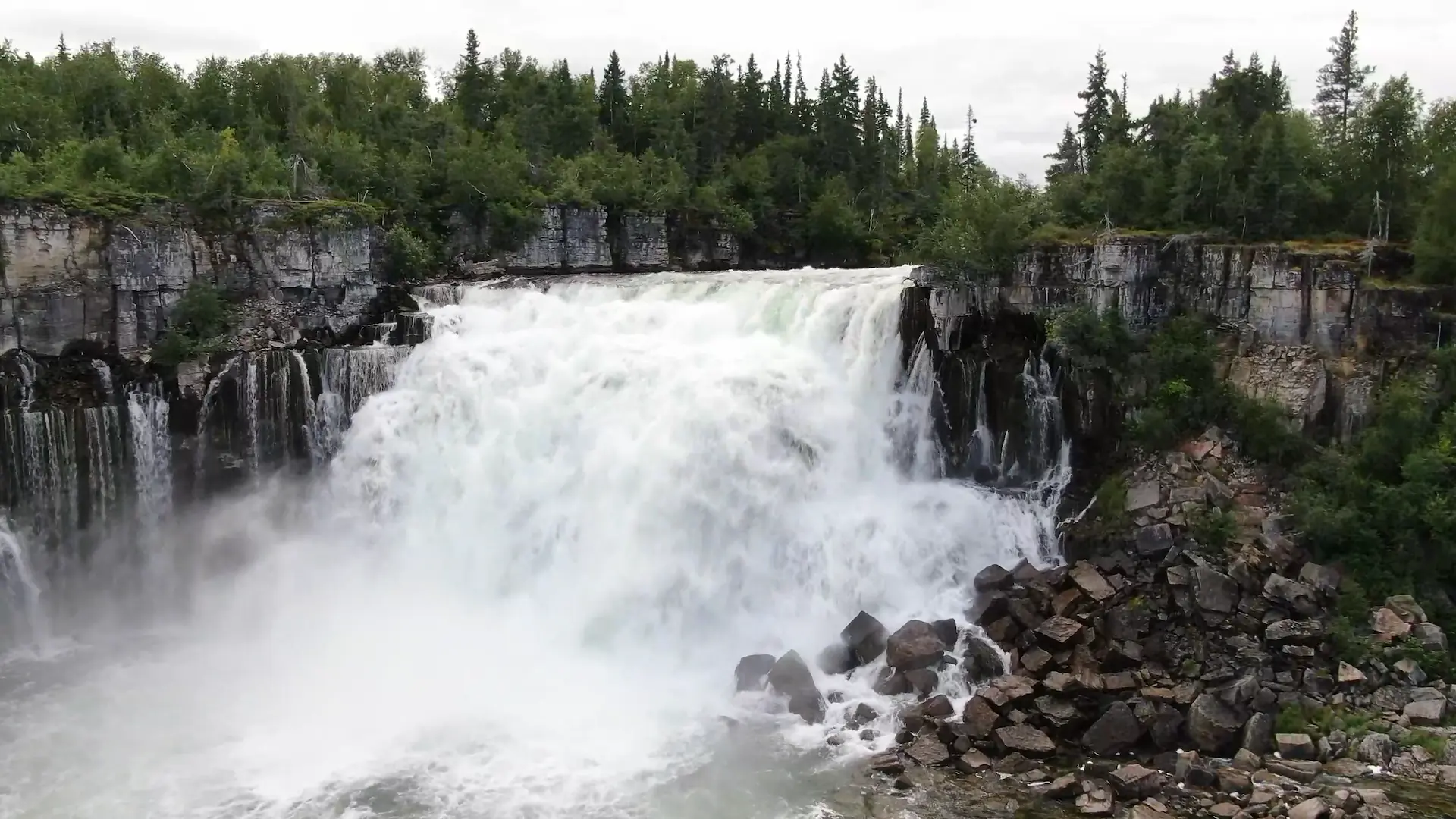 A close-up drone photography image of Whatì Falls.