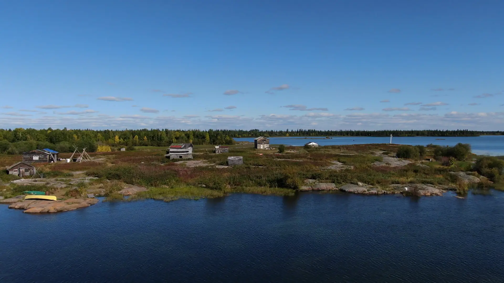 A drone photography image of a small village located on the north shore of Lac La Martre.